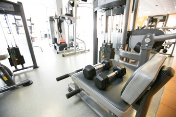 Fototapeta na wymiar Sports dumbbells metal for bodybuilding in the gym.
