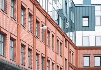 Element of a red brick building business center in the city center.