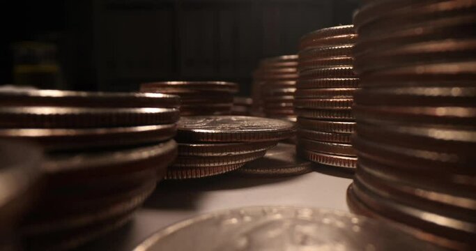 Many coins of American cents on dark background slow motion 4k movie