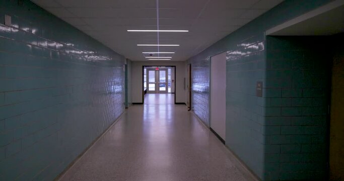 Empty school hallway with gimbal video walking forward.