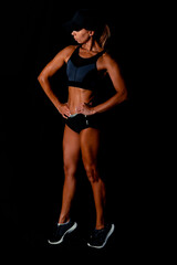 Fitness female woman with muscular body, do her workout. Attractive sexy fitness woman, trained female body, lifestyle portrait, caucasian model.