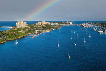The drone aerial panoramic view of Paradise Island and Nassau port with rainbow, Bahamas.