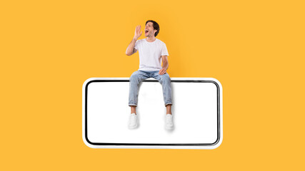 Guy sitting on white empty smartphone screen and making announcement