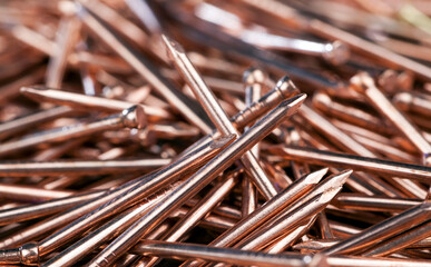 nails are covered with a thin layer of copper-colored metal