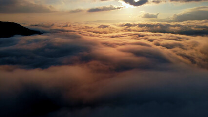 Aerial shot Above Amazing Fluffy Clouds at Morning Time.