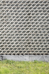 The wall is finished with an unpainted wooden lath