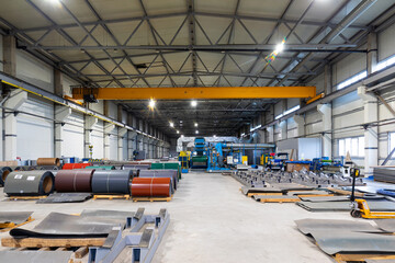 Photo shot of rolls of steel sheet stored in warehouse; Cold rolled steel coils at the factory....