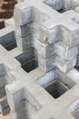 square tiles made of gray natural stone. Concrete street covering of road, geometric paving pattern for building