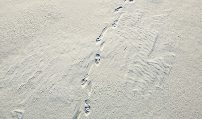 Aerial view of the snowy texture of a frozen lake in winter. North Pole and ice