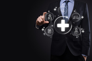 Businessman hold virtual plus medical network connection icons. Covid-19 pandemic develop people awareness and spread attention on their healthcare.Doctor,document,medicine,ambulance,patient icon.