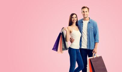 Holiday sales actions, rebates, discounts offers concept image - happy couple with shopping bags,...