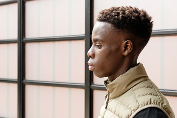 Young black man with short haircut profile portrait