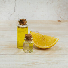Essential oil of orange in a glass bottle with orange. Aromatherapy. The concept of natural cosmetics