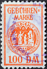 Germany - Circa 1970 A postale stamp from Germany showing the coat of arms of the University of Cologne on an administration fee stamp