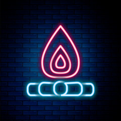 Glowing neon line Campfire icon isolated on brick wall background. Burning bonfire with wood. Colorful outline concept. Vector