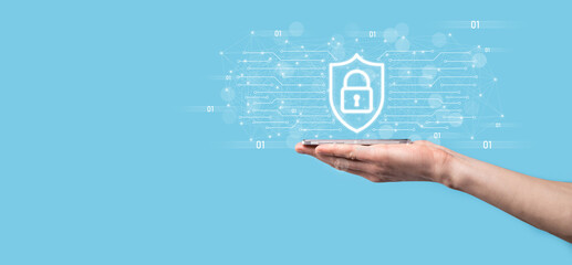 Protection network security computer and safe your data concept, Businessman holding shield protect icon. lock symbol, concept about security, cybersecurity and protection against dangers