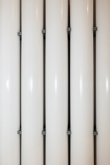 Stack of white PVC Pipes Arranged Randomly