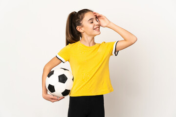 Little football player girl isolated on white background smiling a lot