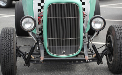 Classic custom vintage car displayed outdoors.