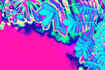 Neon pink and mint tropical leaves background texture. Futuristic surreal solarized Vaporwave plants pattern. Abstract pixelated art. Night club jungle psychedelic summer party flyer with copy space