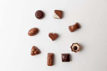 Chocolates with heart shape isolated on white background.