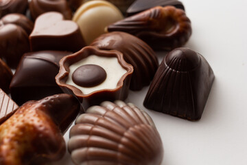 Variety of chocolates isolated on white background.