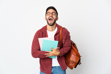 Young student man isolated on white background smiling a lot