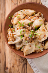 dumplings with fried bacon and onions. Top view