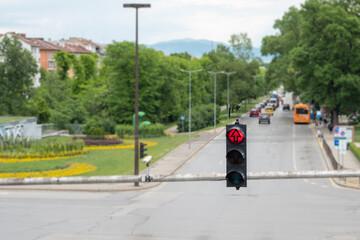 A traffic light over a large intersection with a red signal.