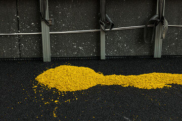 yellow rubber crumb mixed with glue is laid on the surface and ready for application. Installation...