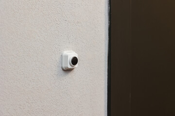 doorbell button at the front door of the apartment from the developer.