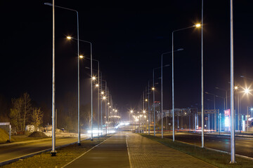 Fototapeta na wymiar night empty walking road with modern LED street lights