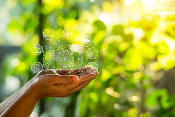 Technology, hand holding with environment Icons over the Network connection on green background