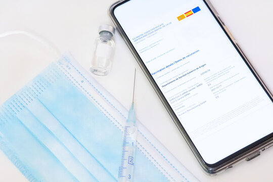 European Covic Passport with all three doses of the vaccine complete. Digital certificate on mobile phone, lifestyle.