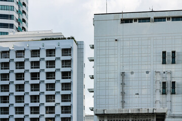 Obraz premium Generic building against a blue clear sky shot in pastel color tones to get that anime inspired city look