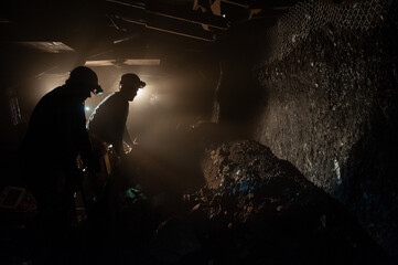 Underground coal mine shaft tunnel drift with miner and light. - obrazy, fototapety, plakaty