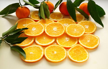 Oranges background. Slices of citrus fruits - oranges. Fruit background with oranges and tangerines.