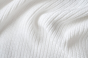 Fototapeta na wymiar Soft knitted sweater texture closeup. Light abstract background. The trendy white backdrop for web design. Luxury twisted fabric backplate with patterns