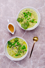 Green cream soup with peas and sesame seeds