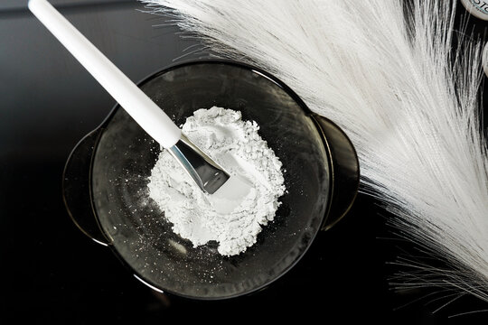 Kaolin clay white powder cosmetic grade for face mask and spa treatments. Black and white colors