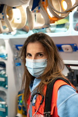 Fototapeta na wymiar close-up of a female doctor in an ambulance wearing a surgical mask