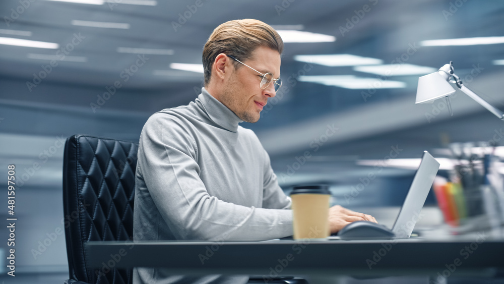 Aufkleber modern office: productive businessman sitting at his desk working on a laptop computer. man working 
