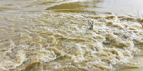 River in flood after several days of rain - image with copy space