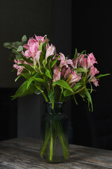bouquet of pink alstroemeria in a vase on the table