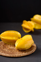 Star fruit on black background. Organic fruit from Thai farmer in local market