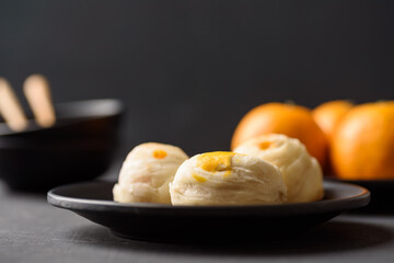 Thai mooncake or Chinese pastry on black background