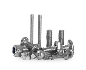 Different metal bolts and nuts on white background