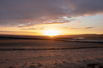 Fototapeta na wymiar Sunset along Llanelli beach in Wales.