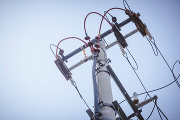 Silhouette Power lines back lit by the afternoon sun
