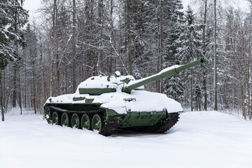 T 80 tank under snow in the forest. Winter tank camouflage